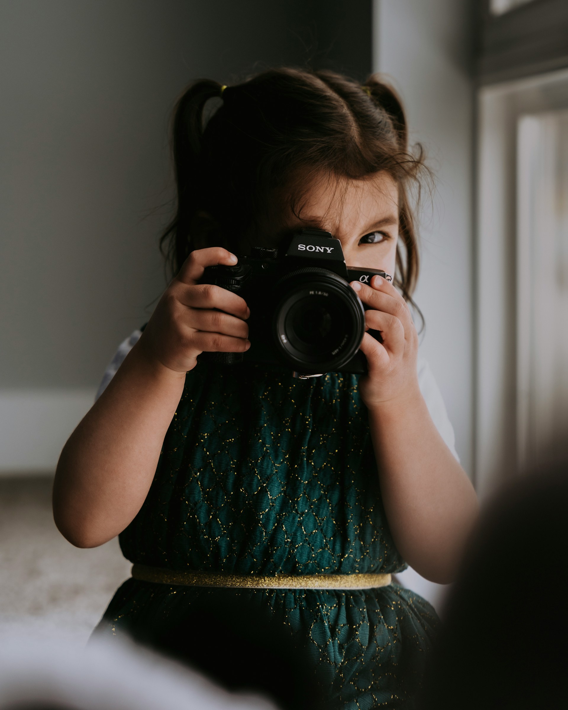 baby holding a camera