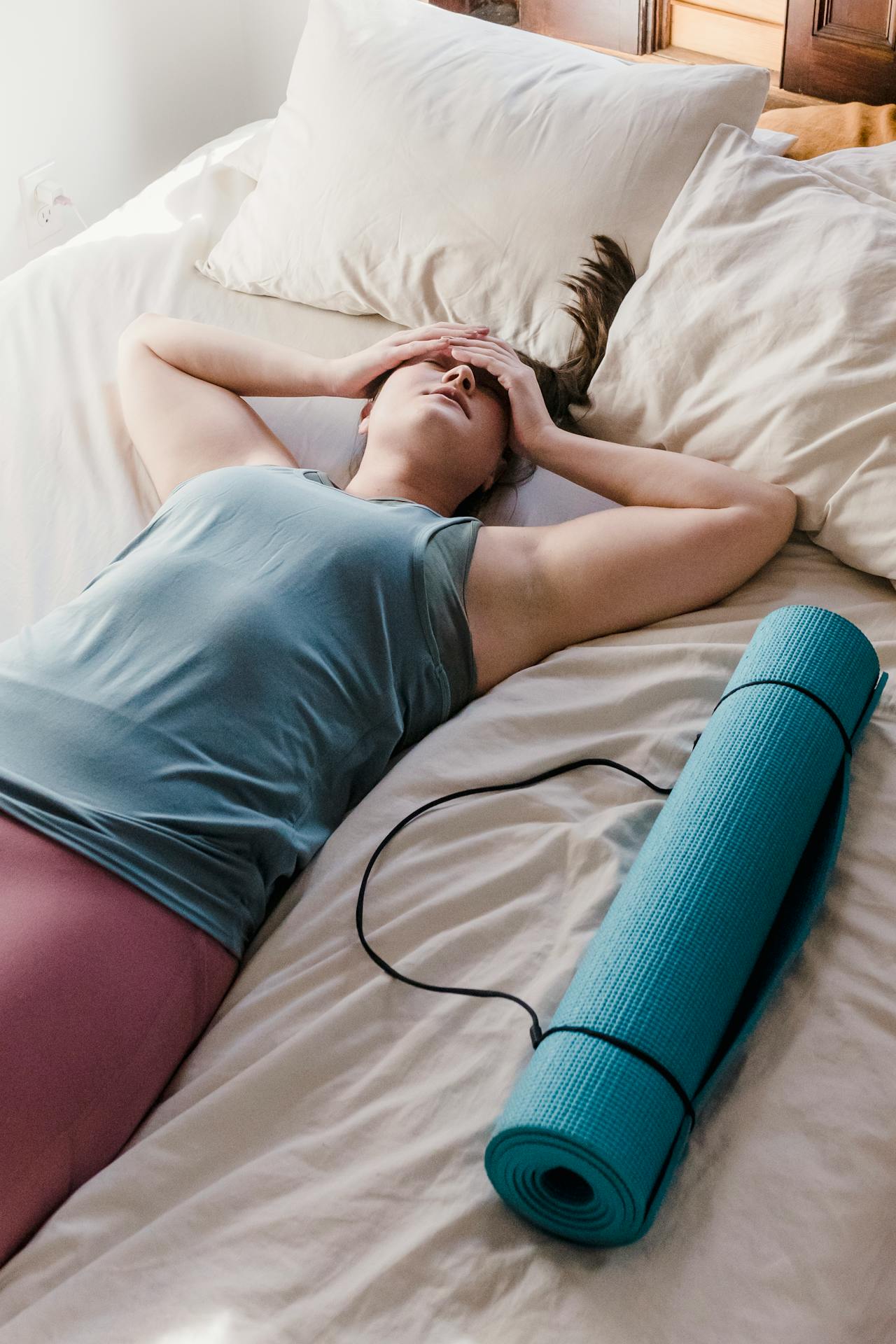 a mom laying on the bed
