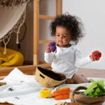 image of a baby playing with toys