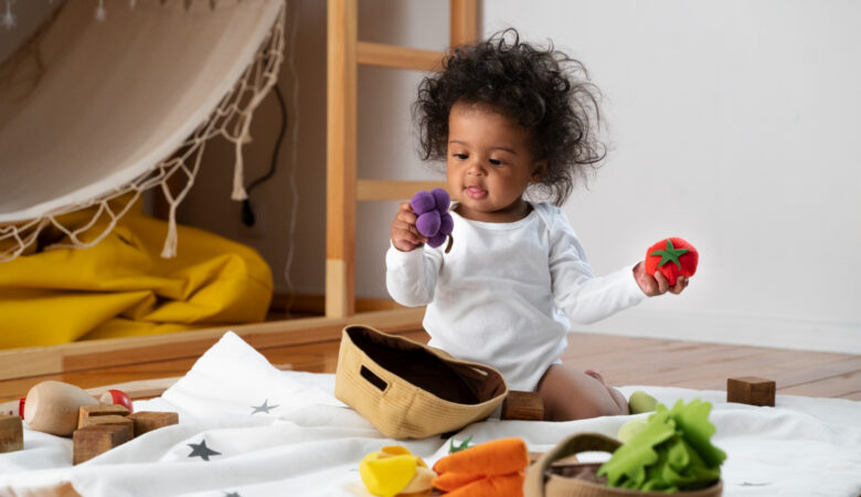 image of a baby playing with toys