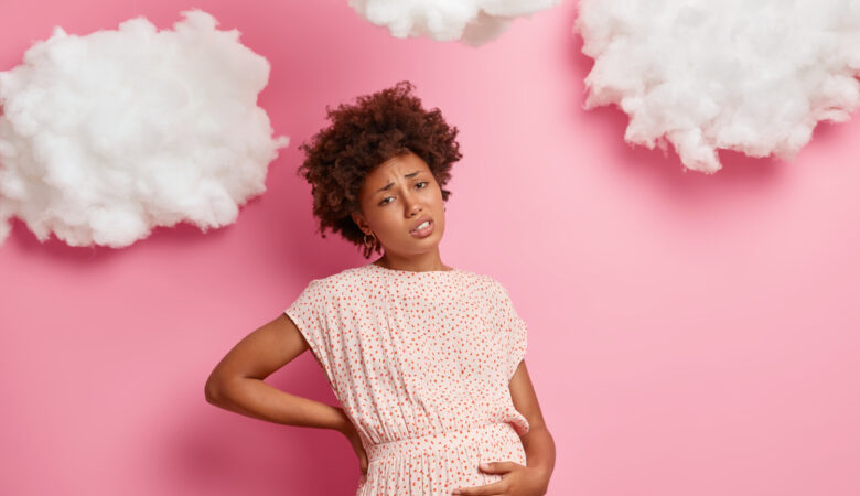 a pregnant lady holding her stomach