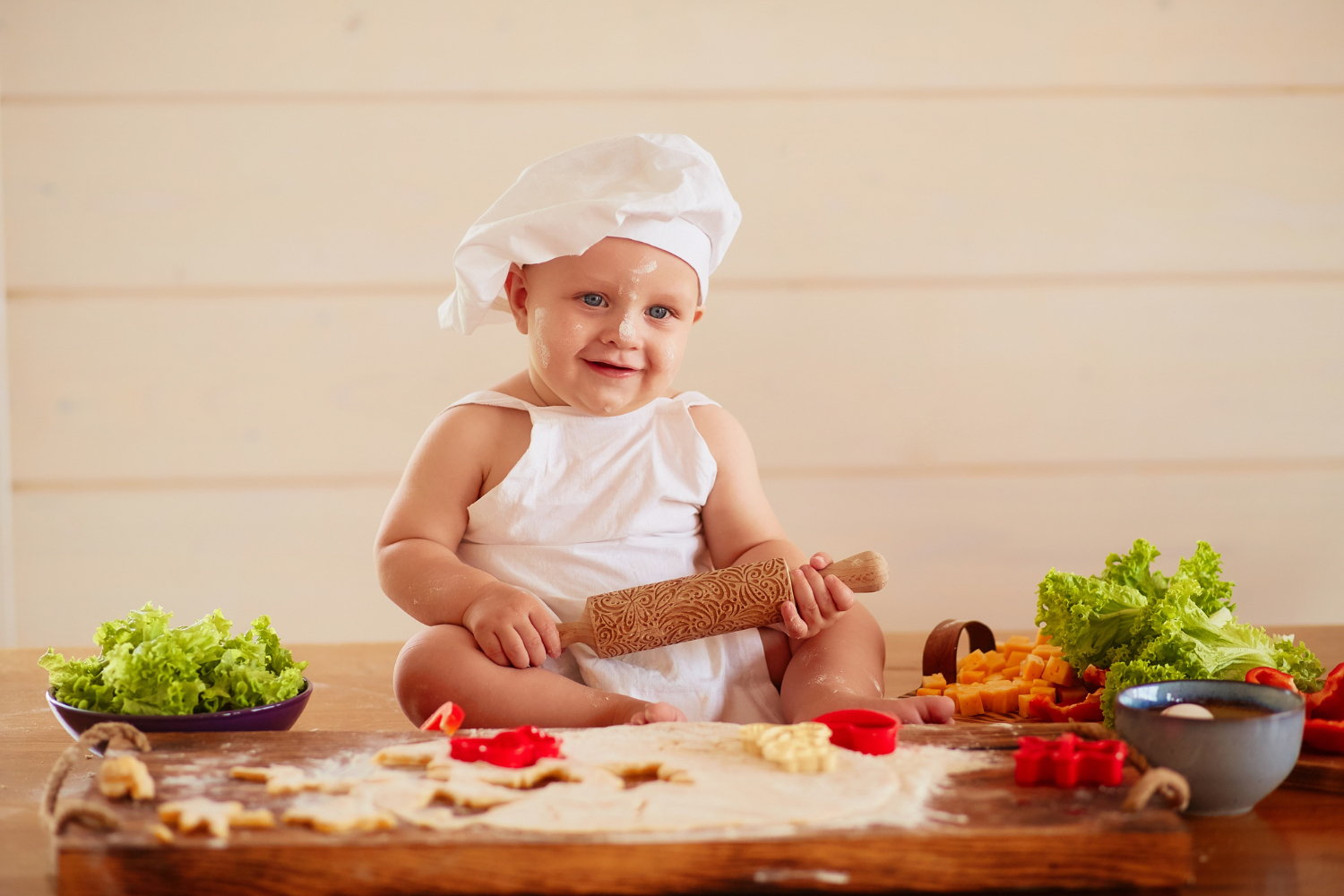 a toddler pretending to be a chef