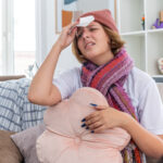 A mom placing her palm on her forehead