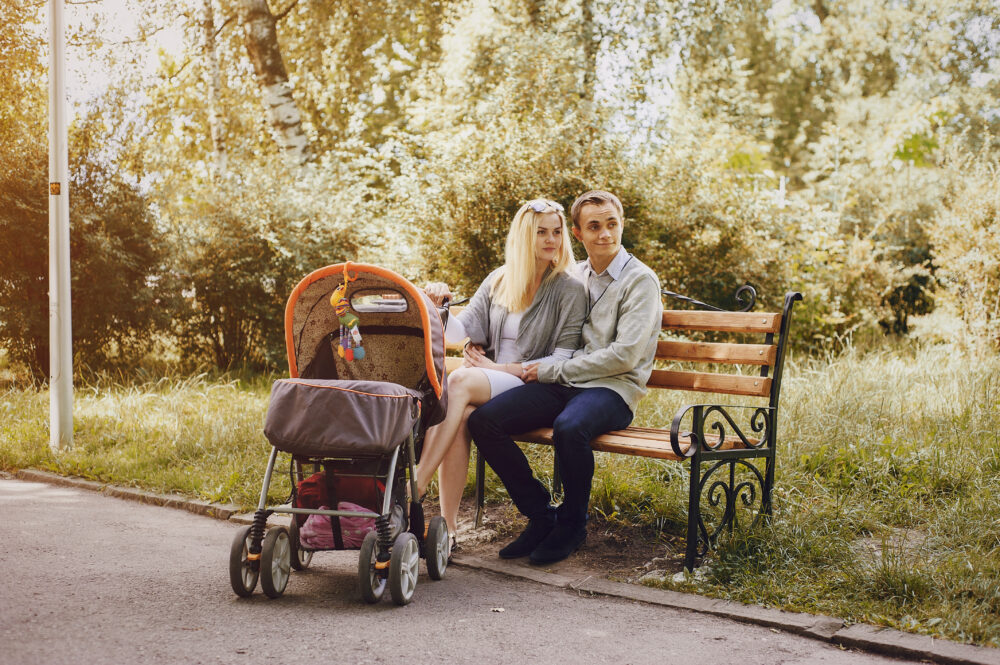 parents sitting with their baby