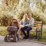 parents sitting with their baby