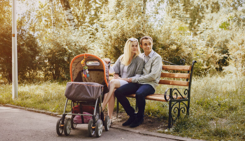 parents sitting with their baby